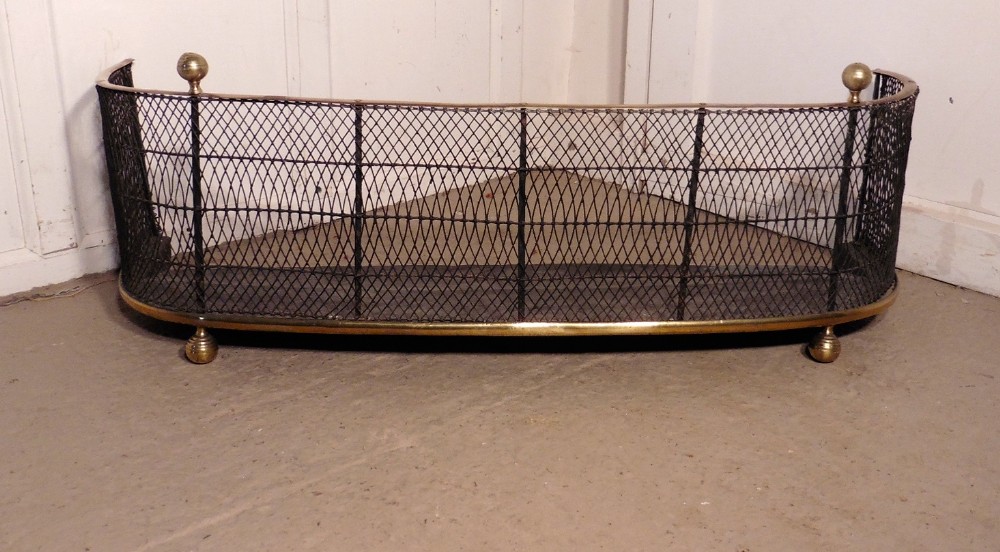 A Victorian Brass and Iron Club Fender