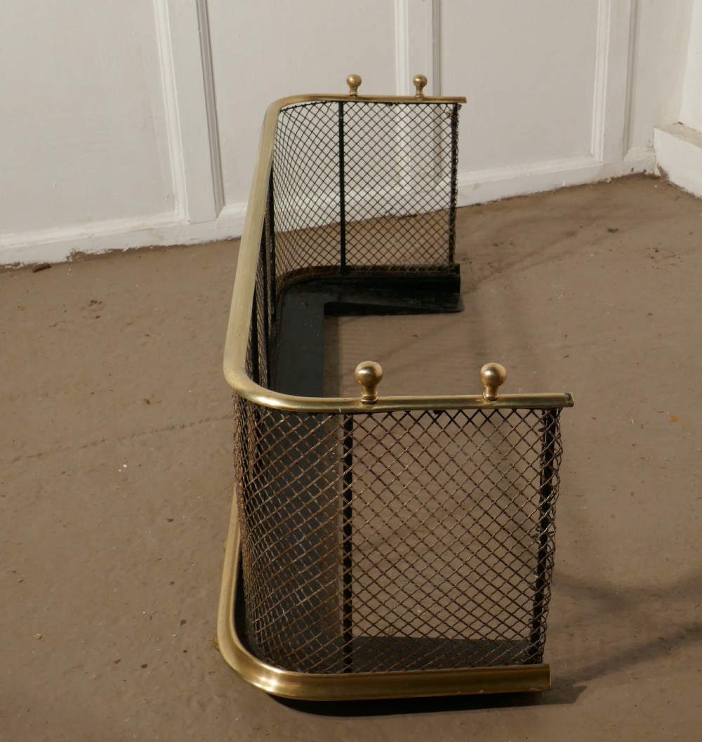 A Victorian Brass and Iron Club Fender View III