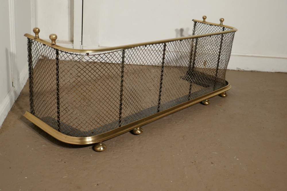 A Victorian Brass and Iron Club Fender View V