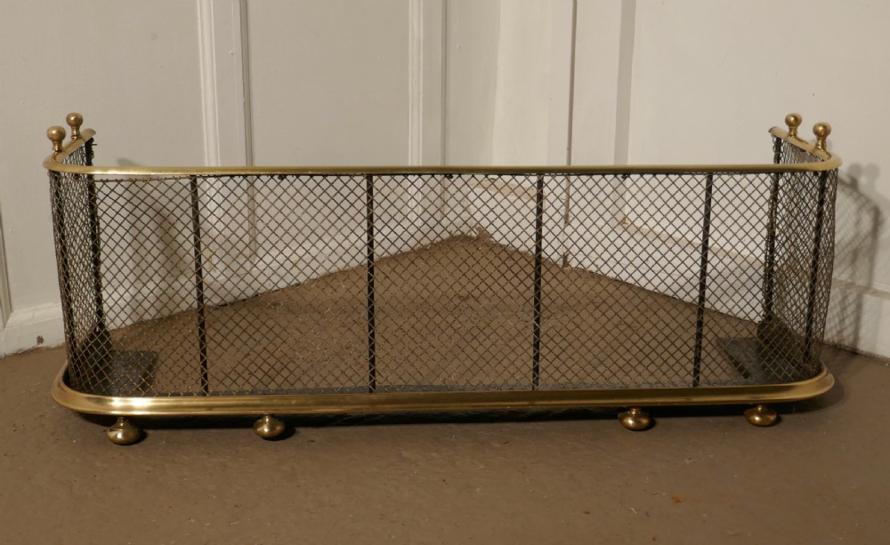 A Victorian Brass and Iron Club Fender View VI