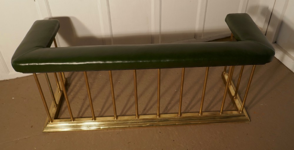 A Large Brass and Green Leather Club Fender View III