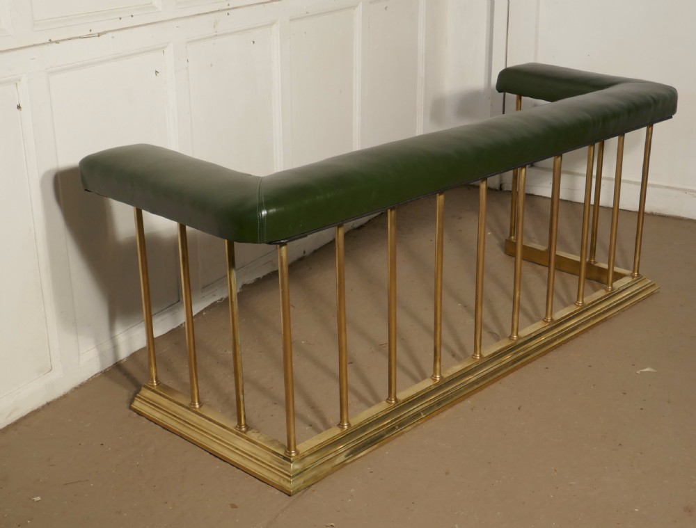 A Large Brass and Green Leather Club Fender View V