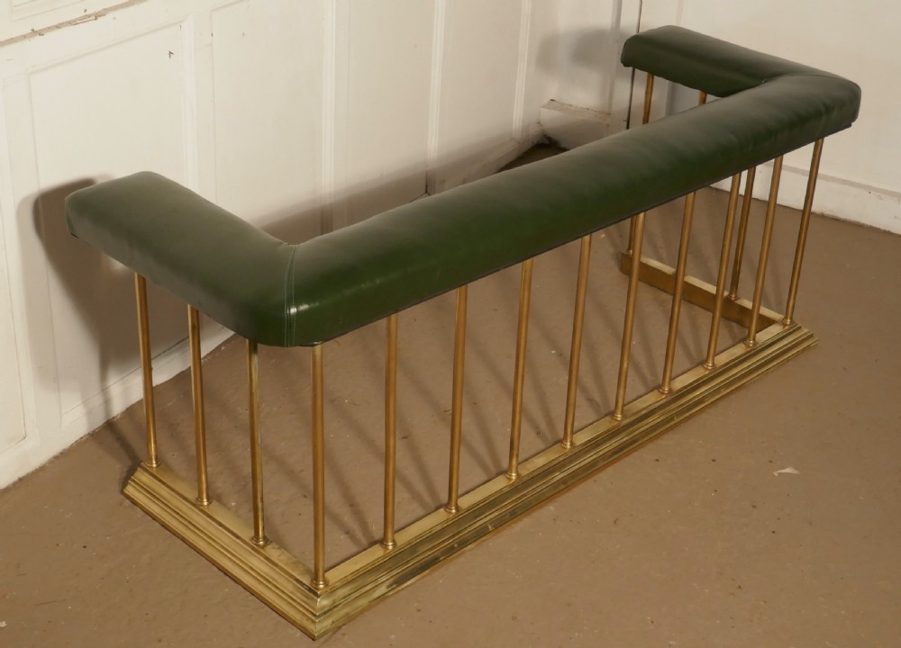 A Large Brass and Green Leather Club Fender View VI