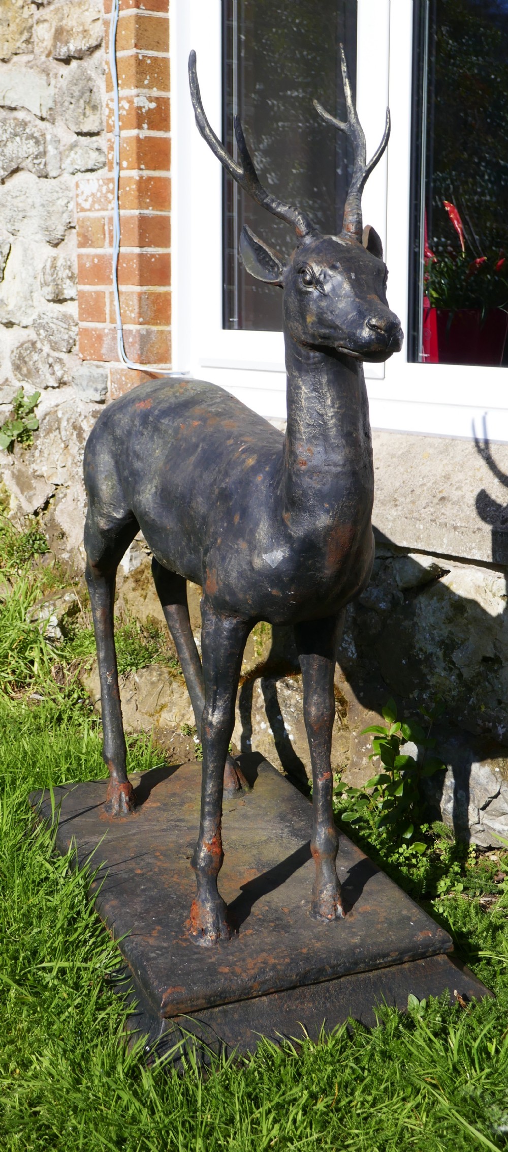 A Large Weather Worn Cast iron Statue of a Young Stag, 