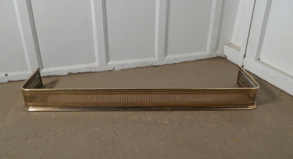 Long Victorian Pierced Brass Fender 