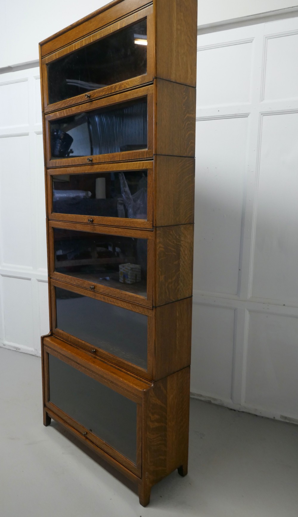 A Tall Art Deco Golden Oak Barrister Waterfall Bookcase, made by Gumm View III