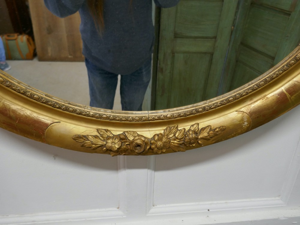 A Large French Rococo Oval Gilt Wall Mirror View II