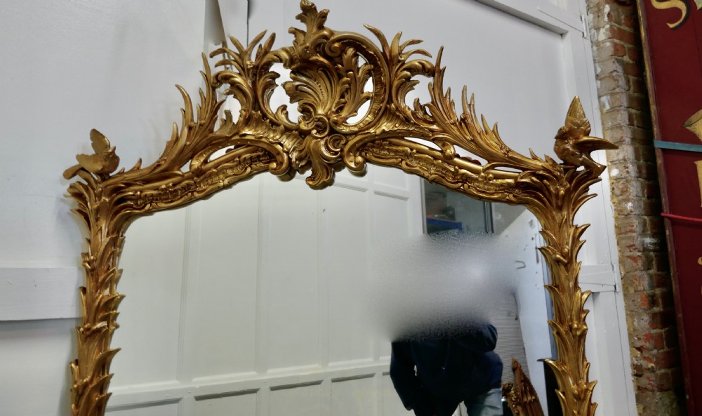 A Large Elaborate French Rococo Gilt Console Mirror Decorated with Leaves and Birds View III