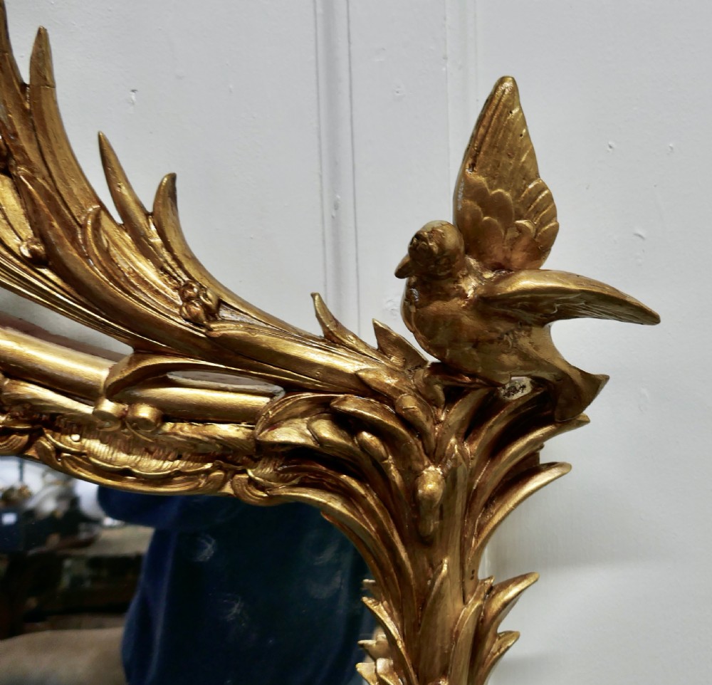 A Large Elaborate French Rococo Gilt Console Mirror Decorated with Leaves and Birds View VII