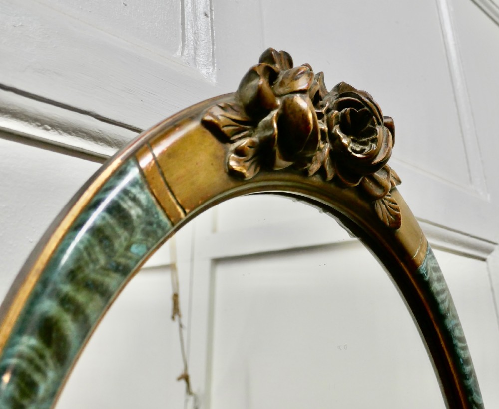 A Large Mirror in Oval Ormolu Frame View IV