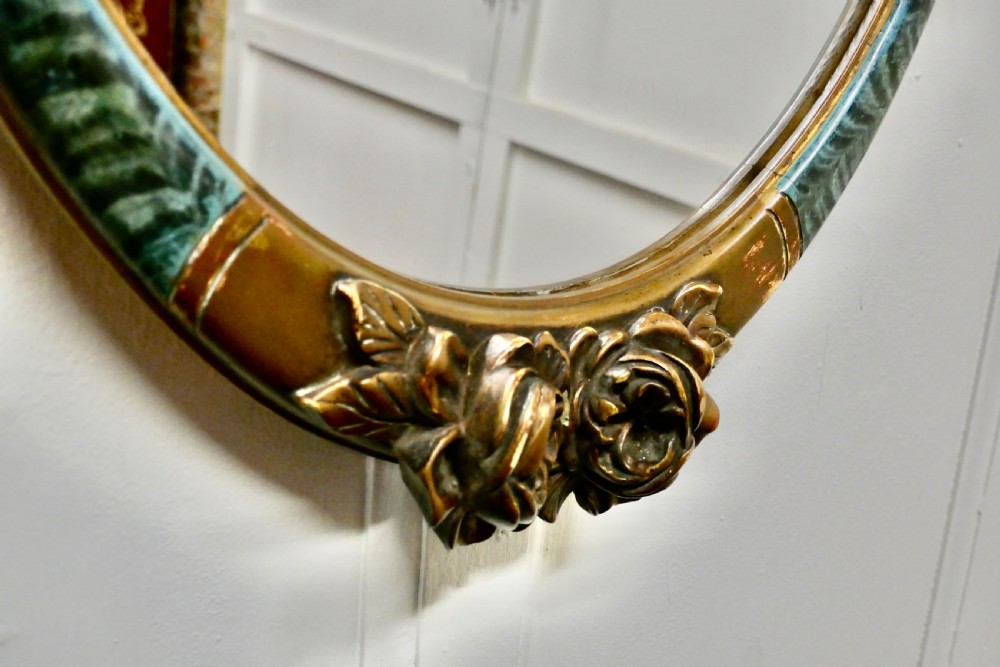 A Large Mirror in Oval Ormolu Frame View V