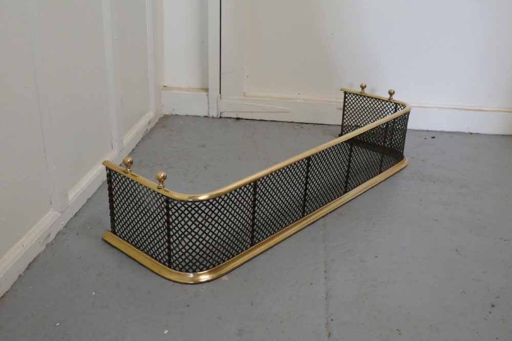 A Victorian Brass and Iron Fender or Fireguard View III