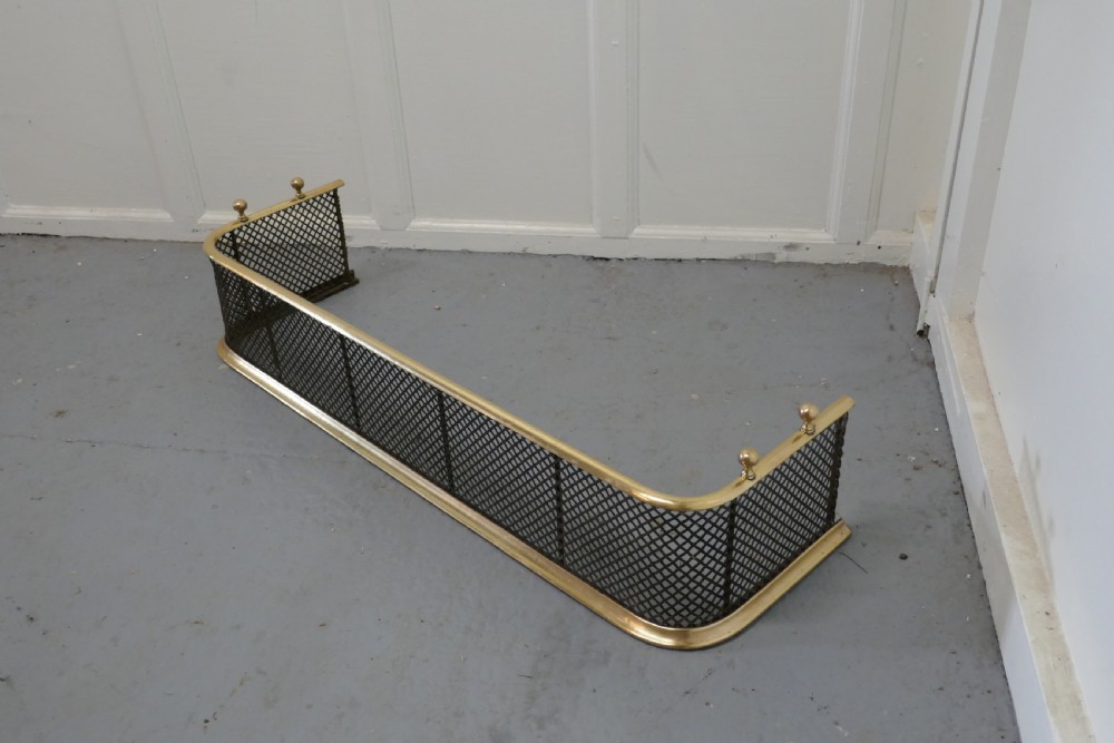 A Victorian Brass and Iron Fender or Fireguard View IV