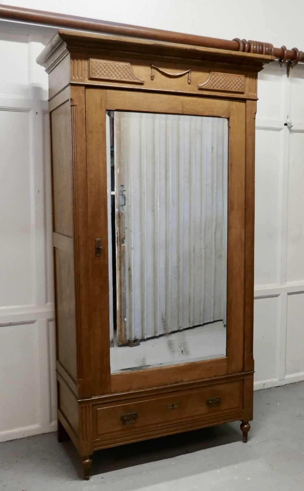 A Victorian Arts and Crafts Golden Oak Mirrored Wardrobe