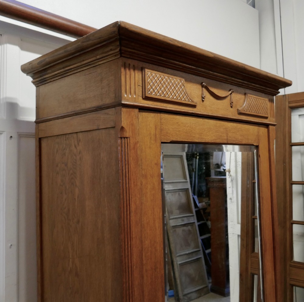 A Victorian Arts and Crafts Golden Oak Mirrored Wardrobe View V