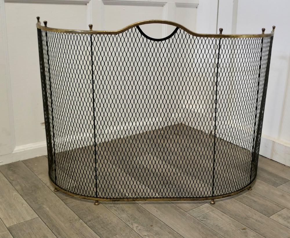 A Victorian Curved Brass and Iron Nursery Fire Guard