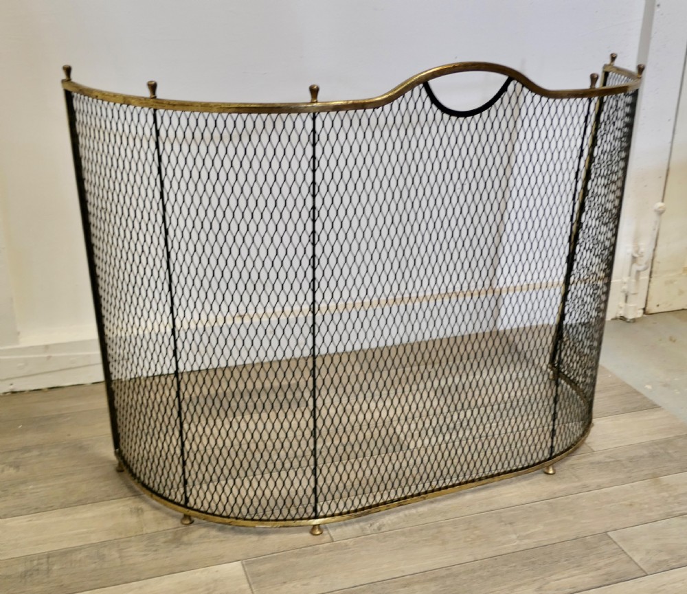 A Victorian Curved Brass and Iron Nursery Fire Guard View V