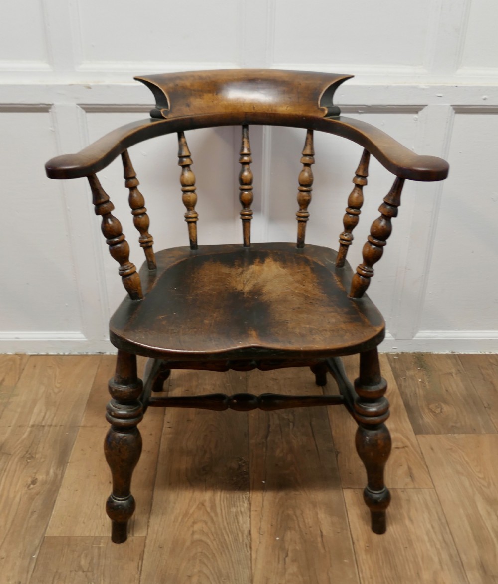 
This style is known by many names Smokers Bow, Windsor Chair  or Captain’s Chair 