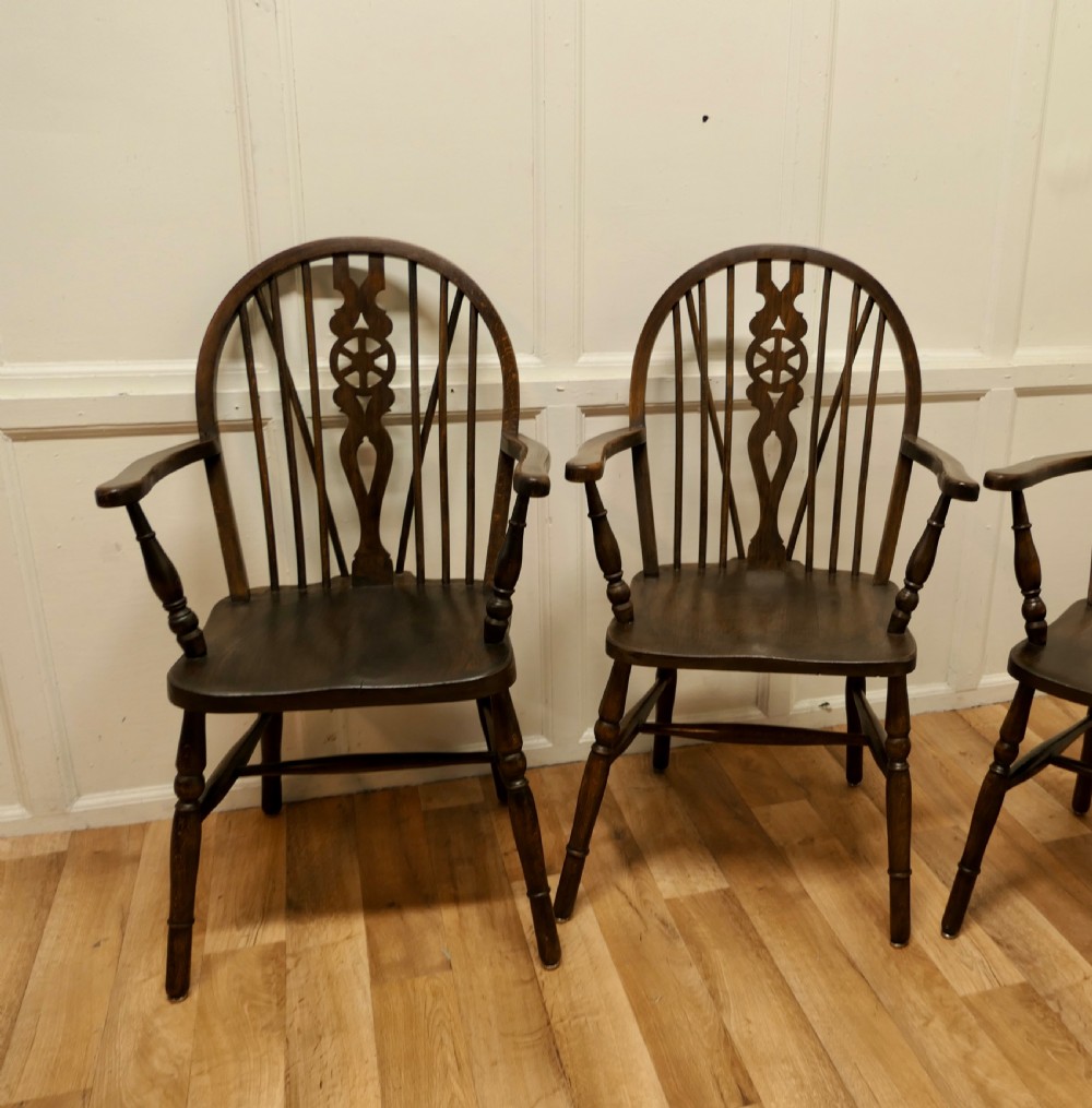 Set of 4 Beech and Elm Wheel Back Carver Chairs View II