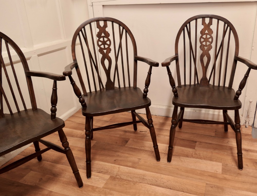 Set of 4 Beech and Elm Wheel Back Carver Chairs View III