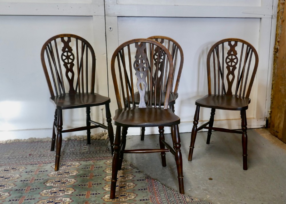 A Set of 4 Beech & Elm Wheel Back Windsor Kitchen Dining Chairs View II