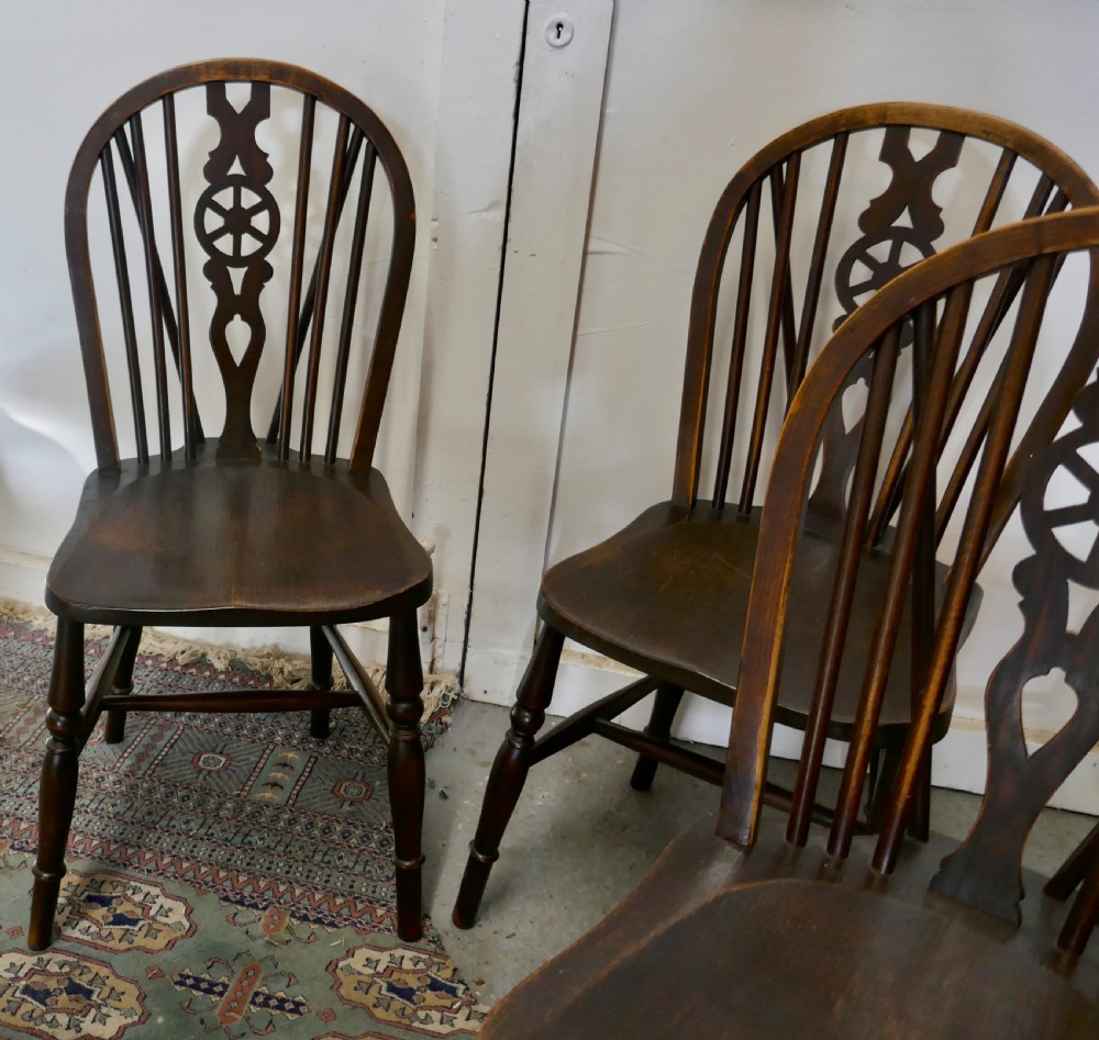 A Set of 4 Beech & Elm Wheel Back Windsor Kitchen Dining Chairs View III