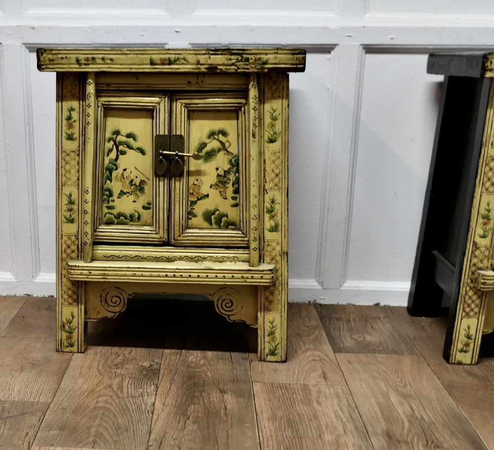 A Superb Pair of Cream Lacquered Chinoiserie Decorated Cabinets.  View II