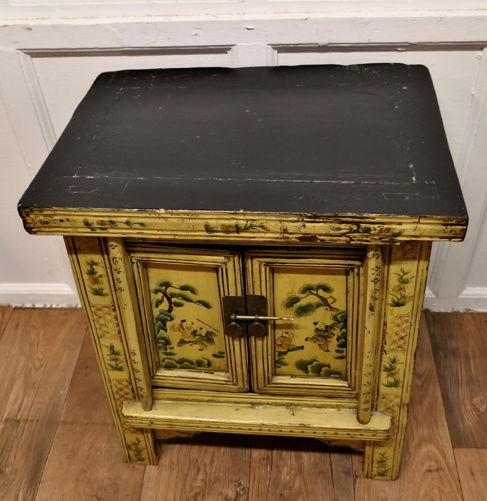 A Superb Pair of Cream Lacquered Chinoiserie Decorated Cabinets.  View V