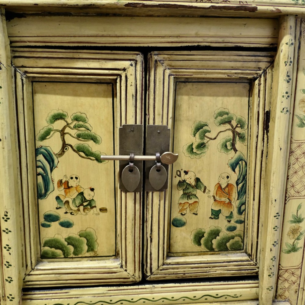 A Superb Pair of Cream Lacquered Chinoiserie Decorated Cabinets.  View XI