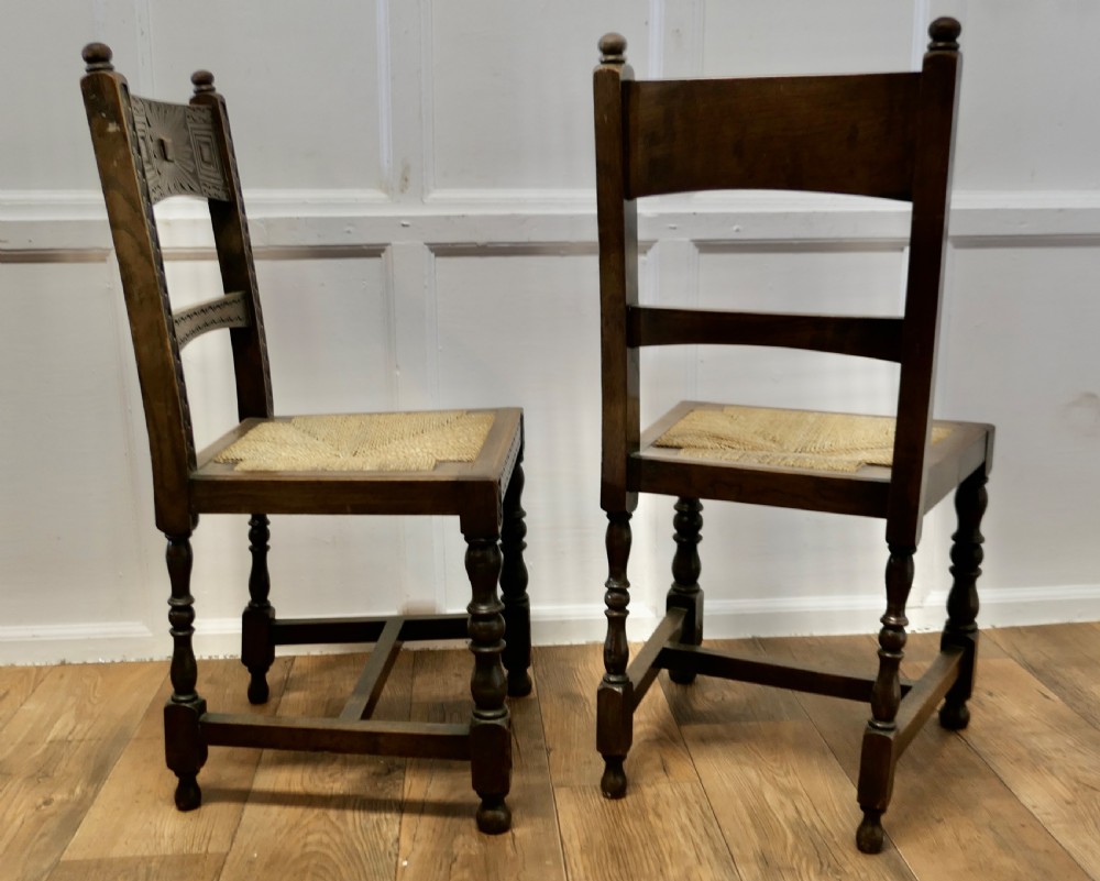 A Pair of Arts and Crafts Gothic Carved Oak Hall Chairs View VI