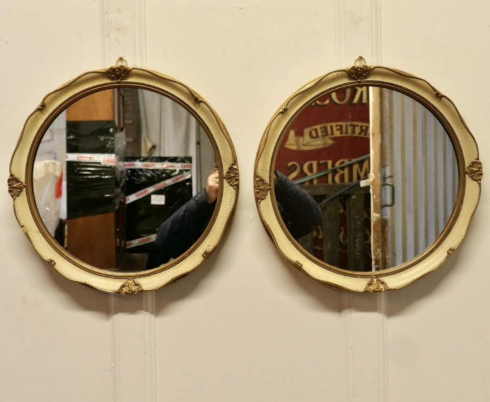 A Pair of French Gilt and Cream Crackle Finish Wall Mirrors