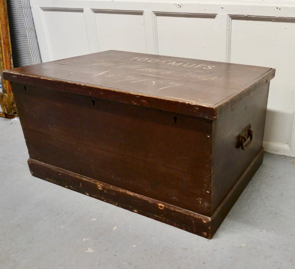 A 19th-century dark stained pine lodge chest featuring white painted lettering on the hinged top lid and a solid plinth base. View III
