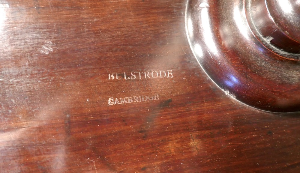 A dark mahogany Art Nouveau wine table featuring a circular two-tone carved top and sweeping tripod legs. View VIII