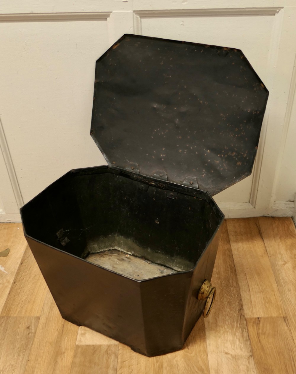 A black painted metal toleware coal box featuring a hand-painted floral design on the lid and side brass ring handles. View IV