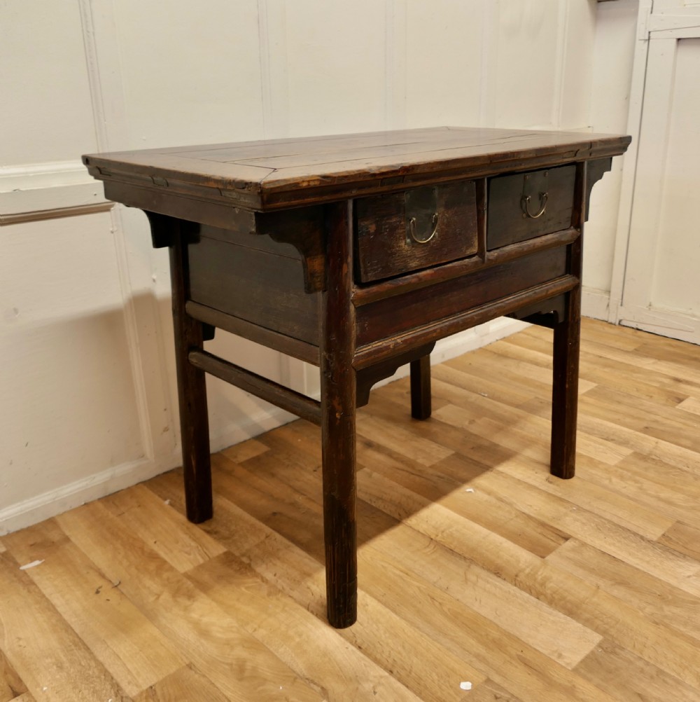 A dark brown lacquered wooden Chinese side table featuring two drawers with brass handles and straight legs. View III
