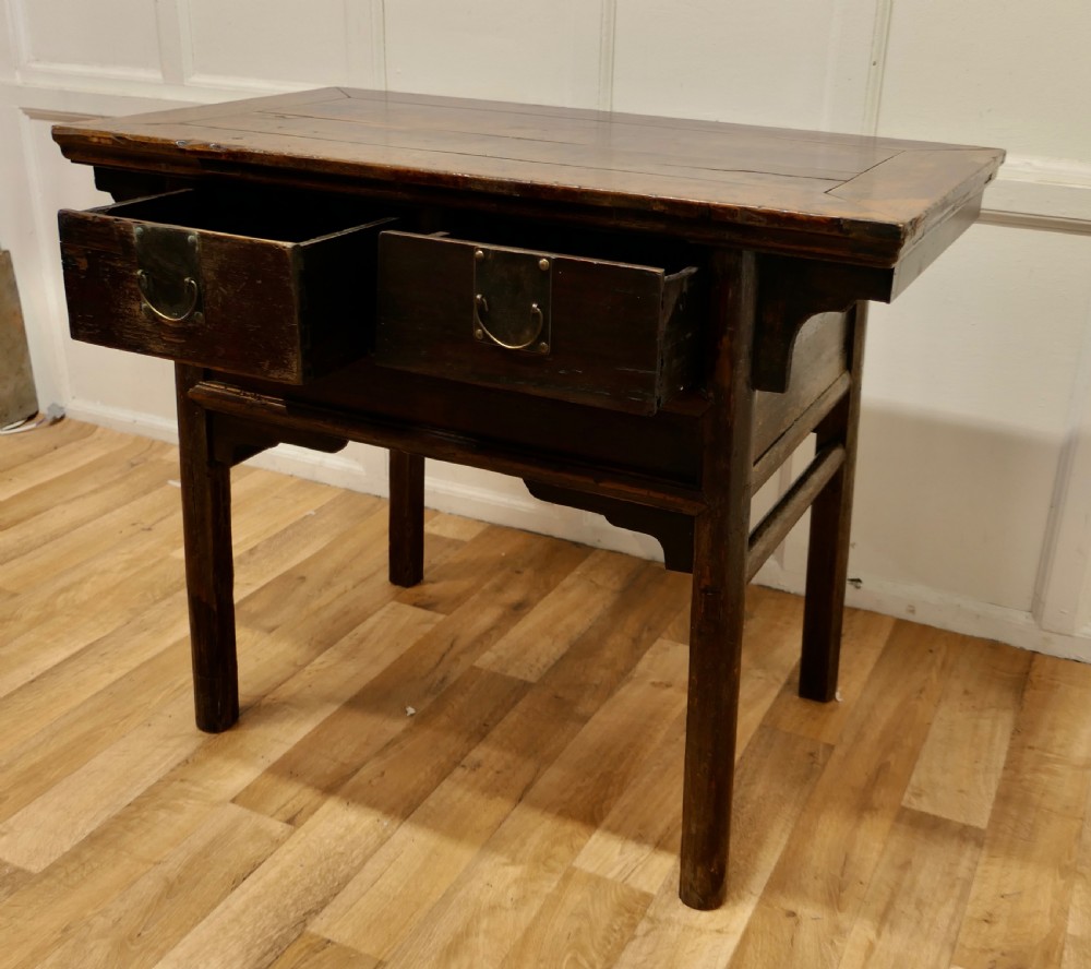 A dark brown lacquered wooden Chinese side table featuring two drawers with brass handles and straight legs. View IV