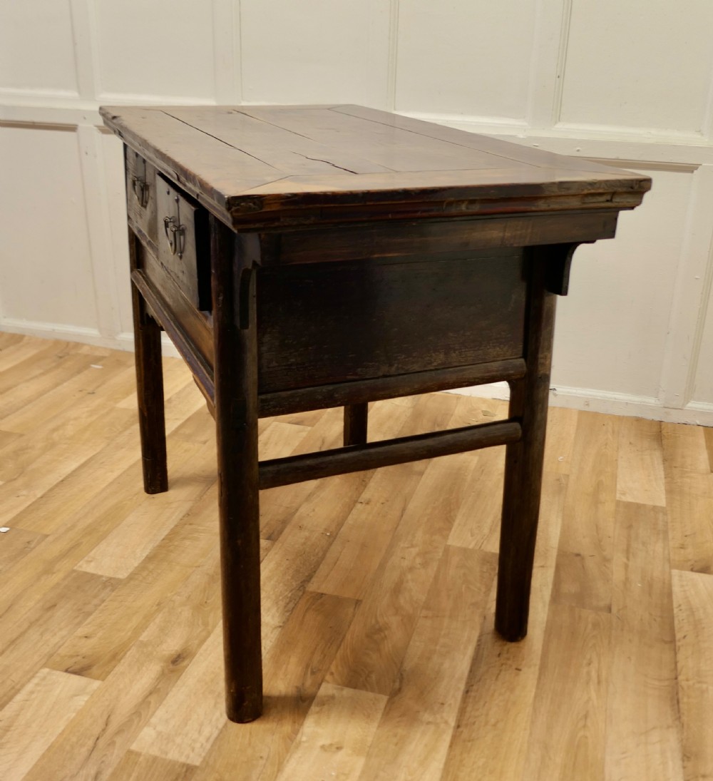 A dark brown lacquered wooden Chinese side table featuring two drawers with brass handles and straight legs. View VI