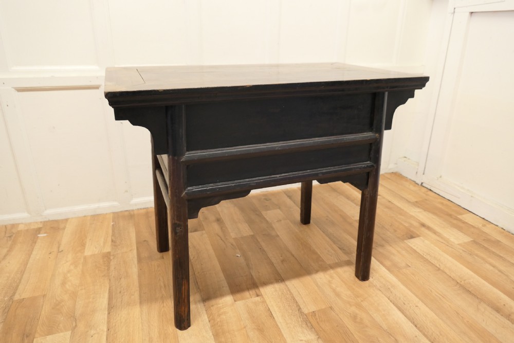 A dark brown lacquered wooden Chinese side table featuring two drawers with brass handles and straight legs. View IX