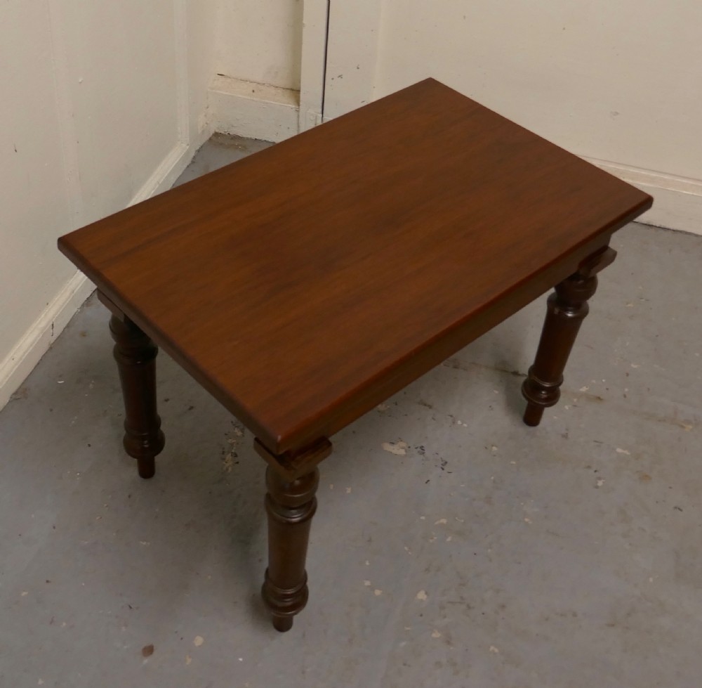 A rectangular Victorian mahogany occasional table with turned legs and a warm brown polish. View III