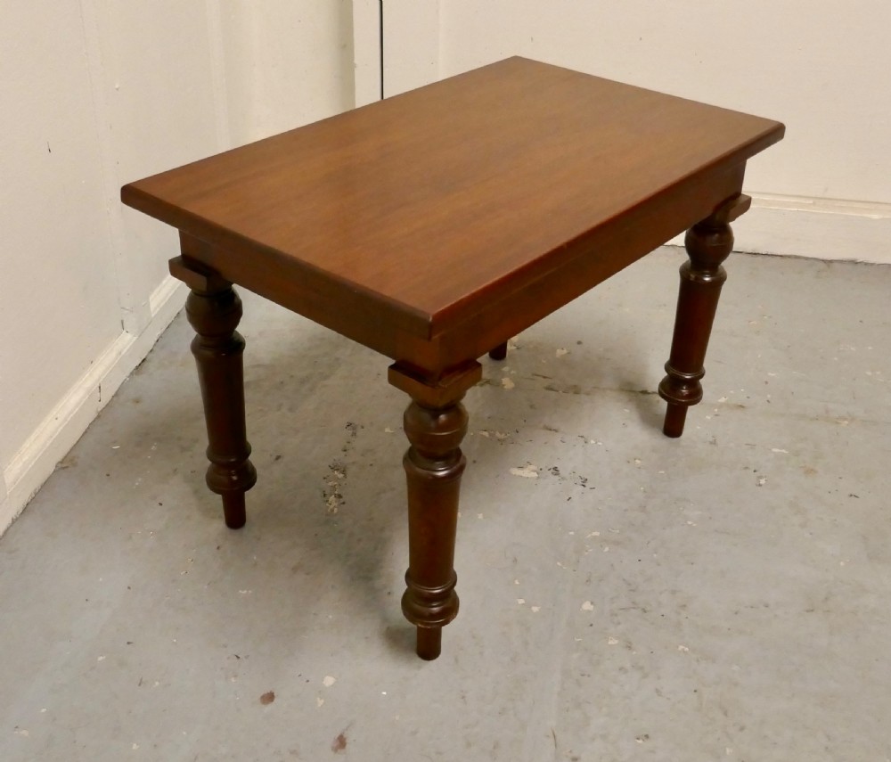 A rectangular Victorian mahogany occasional table with turned legs and a warm brown polish. View V