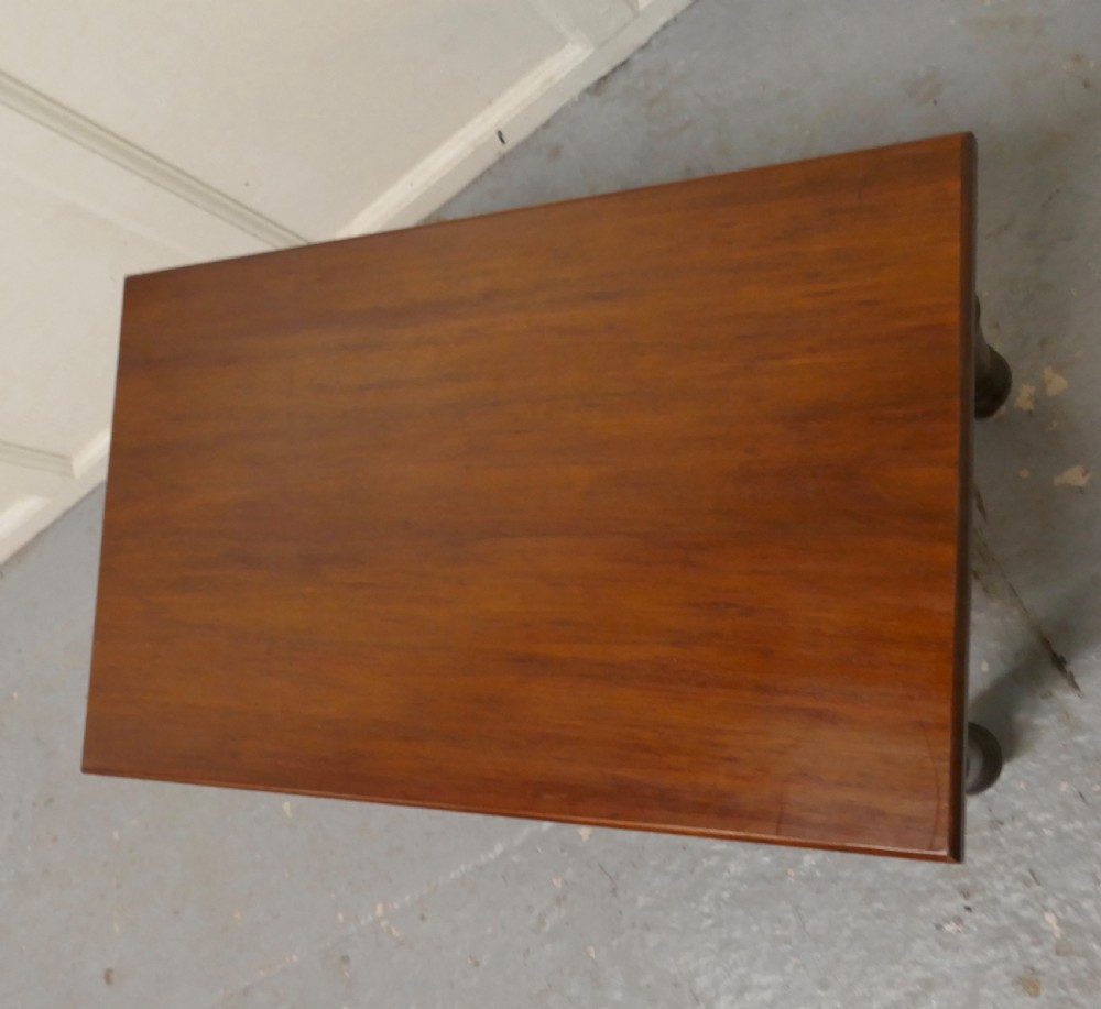 A rectangular Victorian mahogany occasional table with turned legs and a warm brown polish. View VII