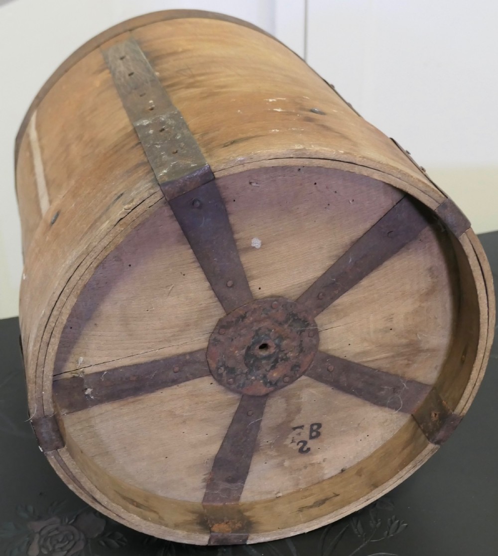 A cylindrical 19th-century French wooden grain measure reinforced with metal bands and stamped with the words DOUBLE DECALITRE. View V