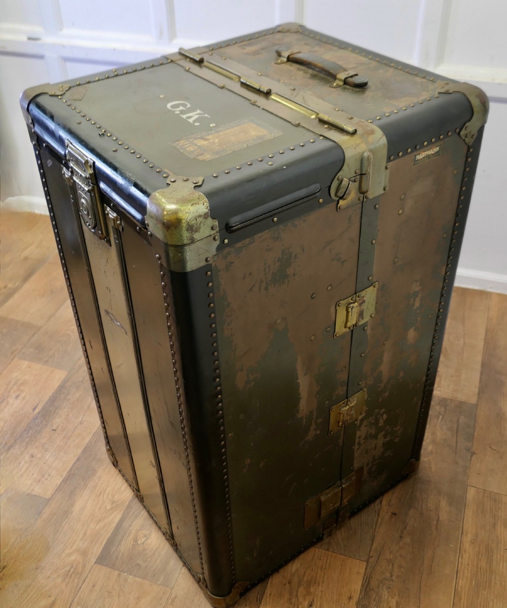 An open Art Deco Hartmann fitted steamer trunk featuring a section with wooden clothes hangers and a section with five pull-out drawers. View VIII