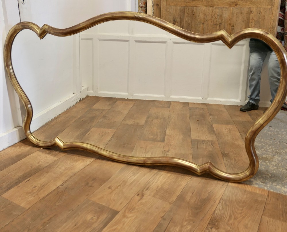 A Superb Very Large Italian Gilt Scallop Shaped Mirror View II