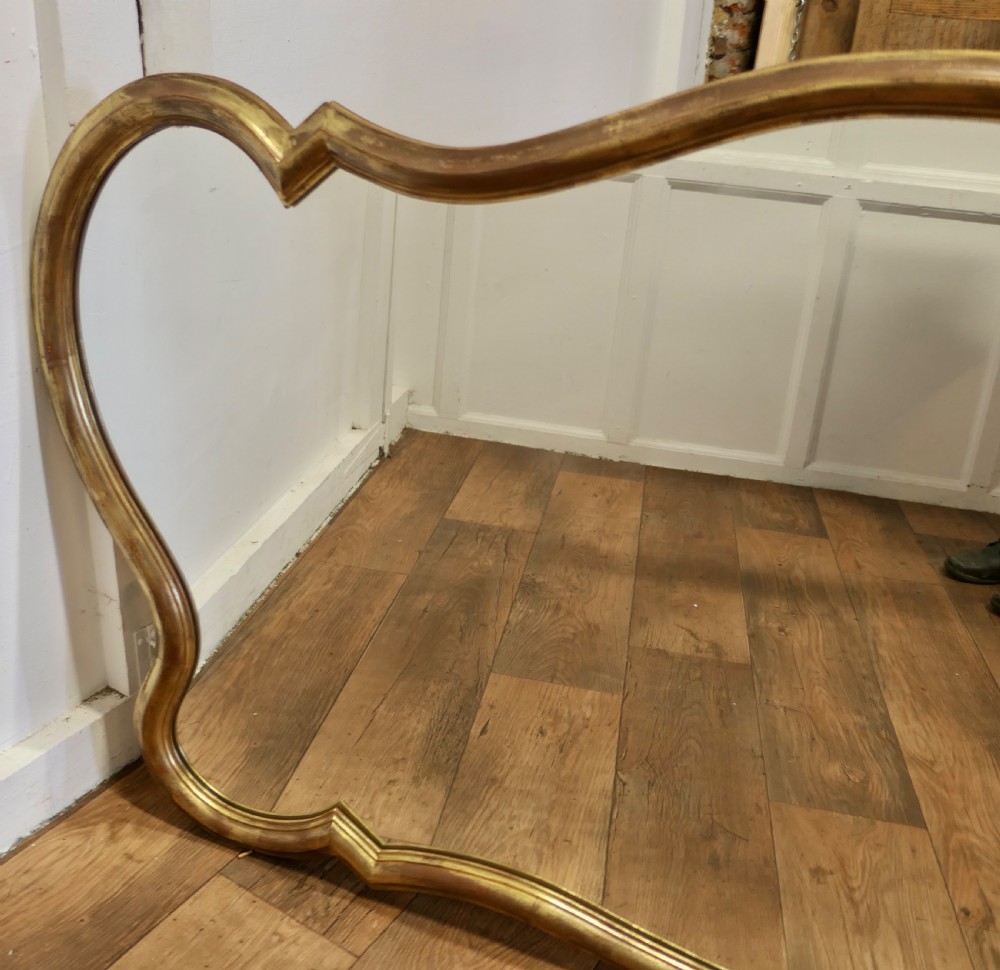 A Superb Very Large Italian Gilt Scallop Shaped Mirror View III
