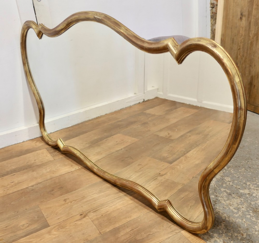 A Superb Very Large Italian Gilt Scallop Shaped Mirror View V