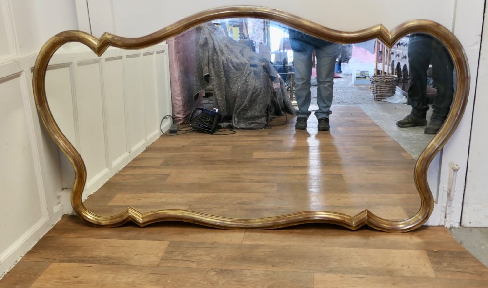 A Superb Very Large Italian Gilt Scallop Shaped Mirror View IX