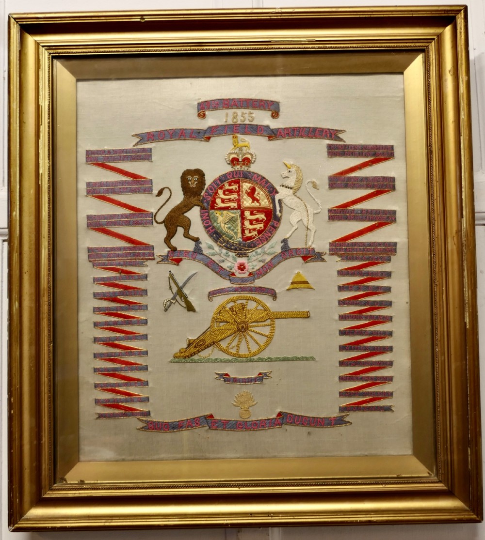 A framed Victorian military silk embroidery panel featuring the Royal Field Artillery coat of arms with lions, unicorns, cannons, and regimental banners within a glazed gilt frame. View II