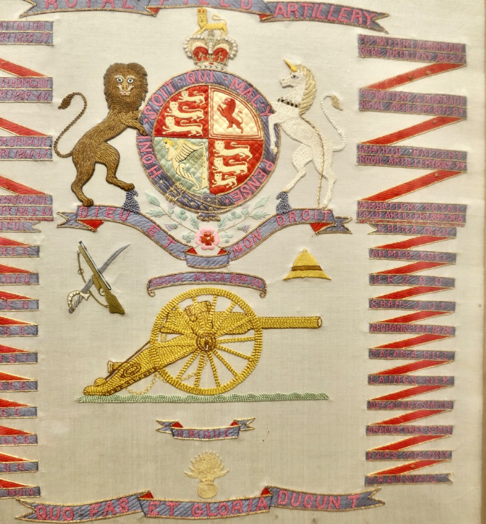 A framed Victorian military silk embroidery panel featuring the Royal Field Artillery coat of arms with lions, unicorns, cannons, and regimental banners within a glazed gilt frame. View III