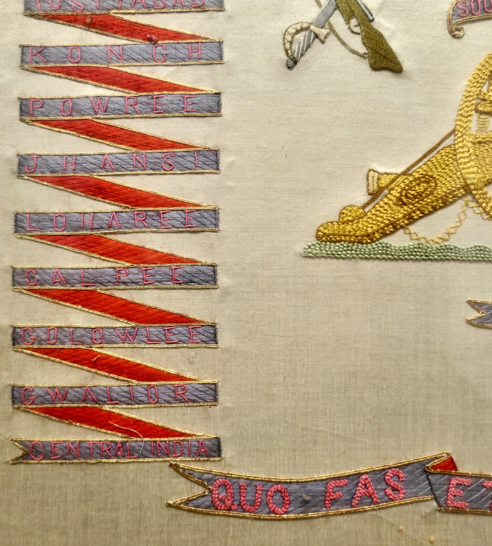 A framed Victorian military silk embroidery panel featuring the Royal Field Artillery coat of arms with lions, unicorns, cannons, and regimental banners within a glazed gilt frame. View IV